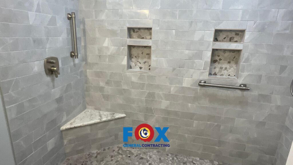 Modern walk-in shower with sleek tile and glass enclosure in a Spanish Fort bathroom